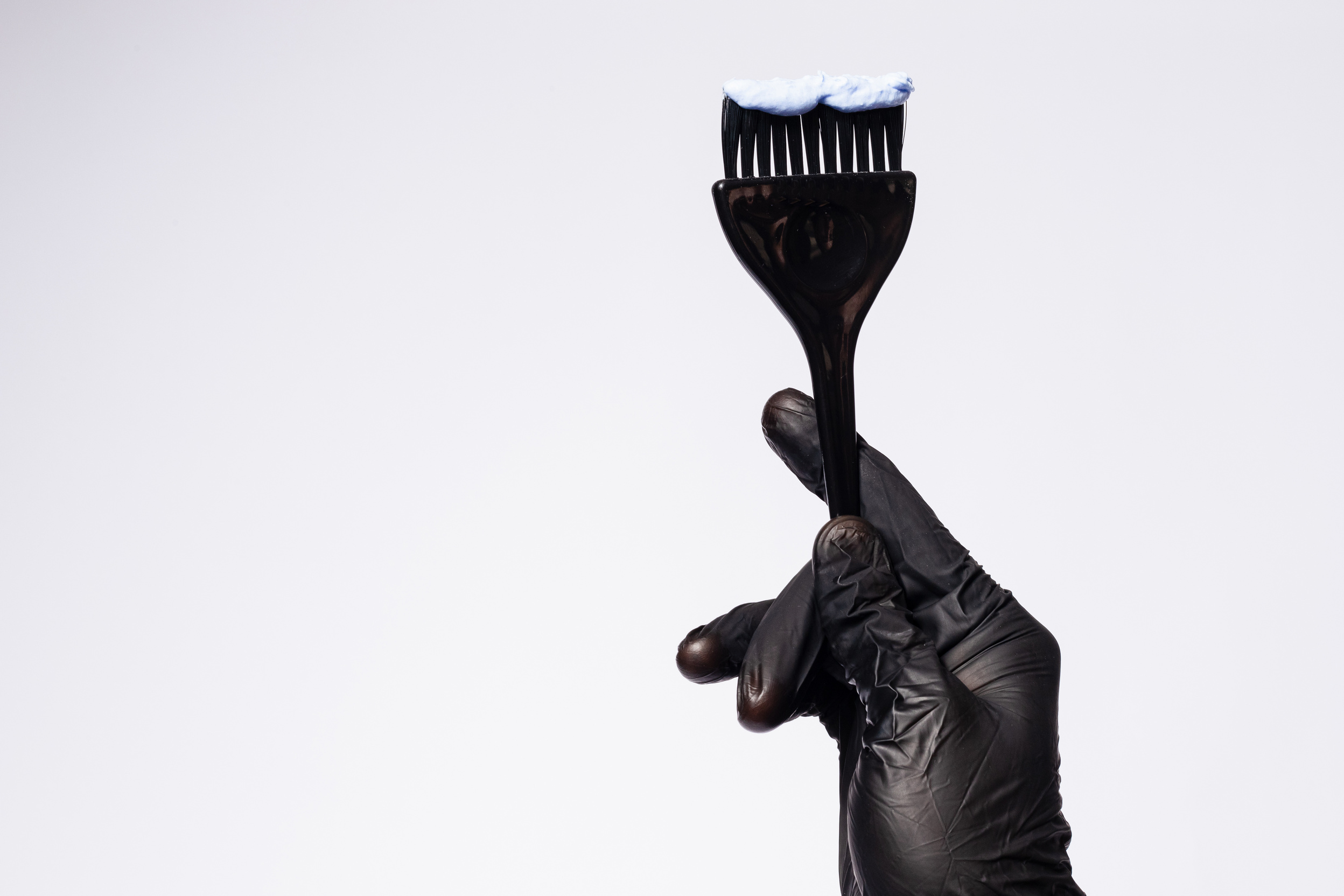 Conceptual Salon Services Hand Holding Hair Color Brush